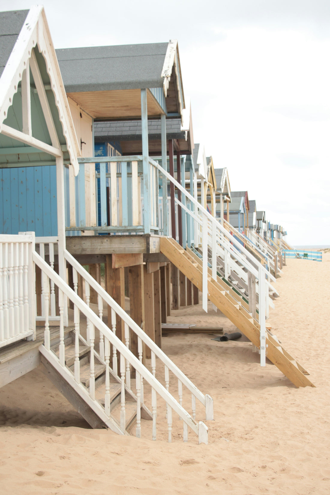Beach huts in Norfolk on a quiet stretch of sand