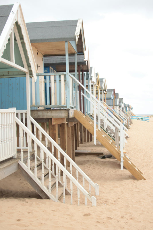 Beach huts in Norfolk on a quiet stretch of sand