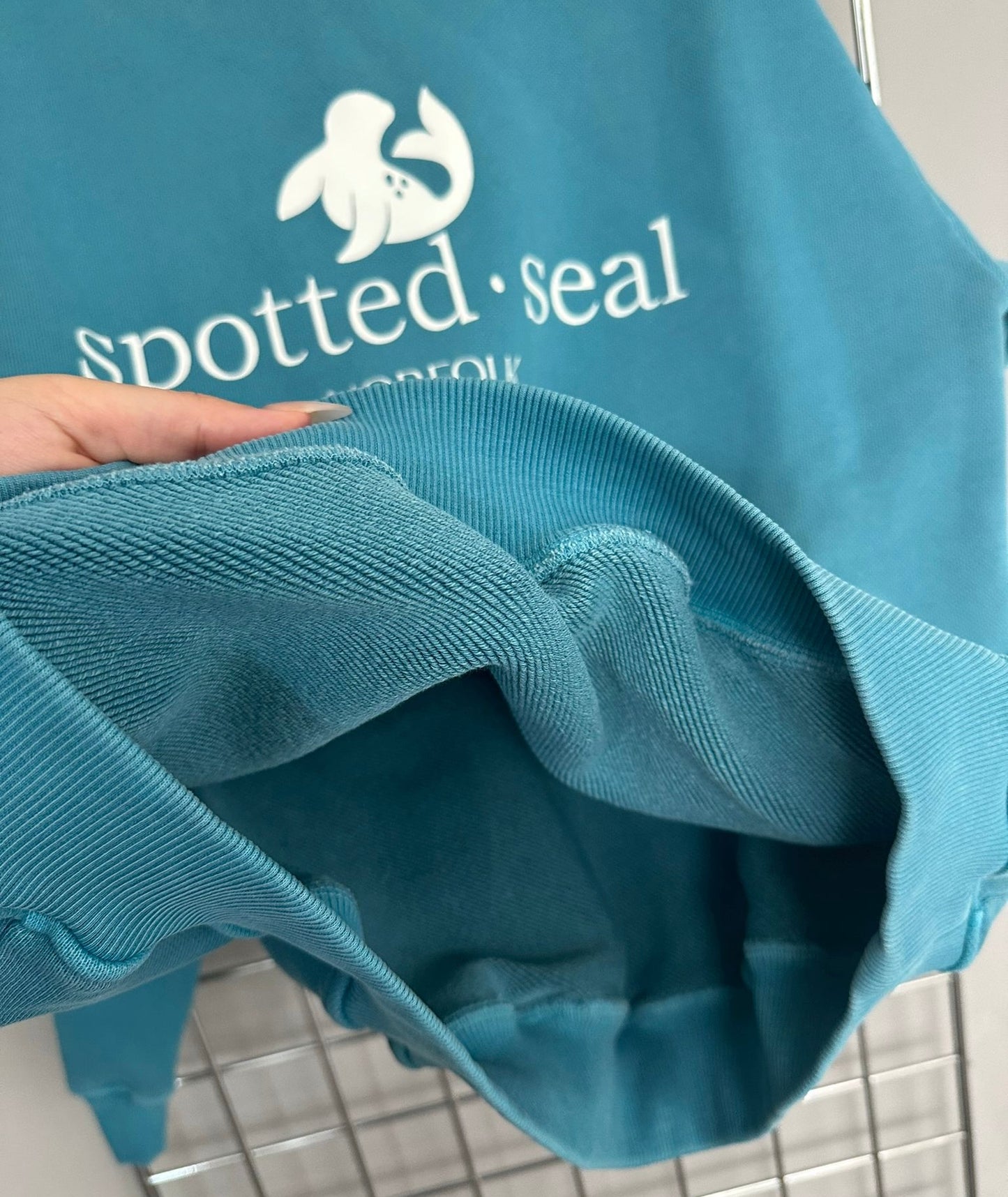 close up of spotted-seal hoodie 100% cotton diagonal loopback cotton fabric detail