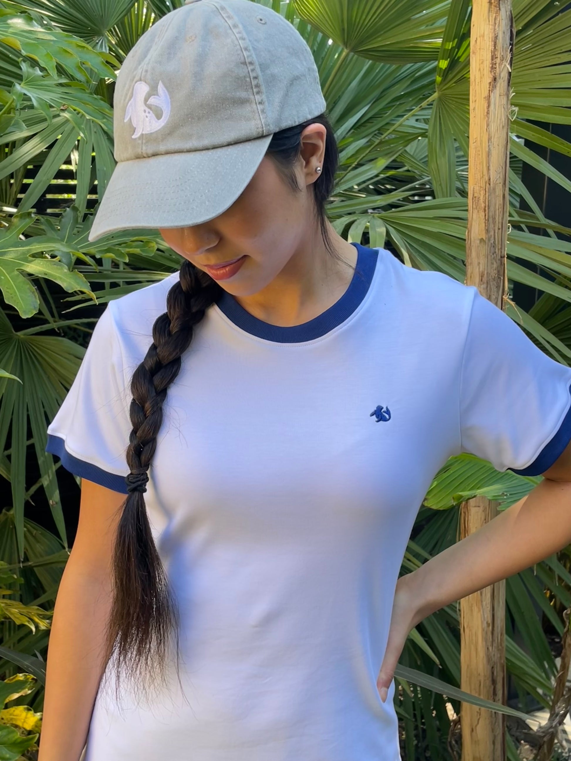 girl looking down in spotted-seal retro-ribbed t-shirt and spotted-seal cap